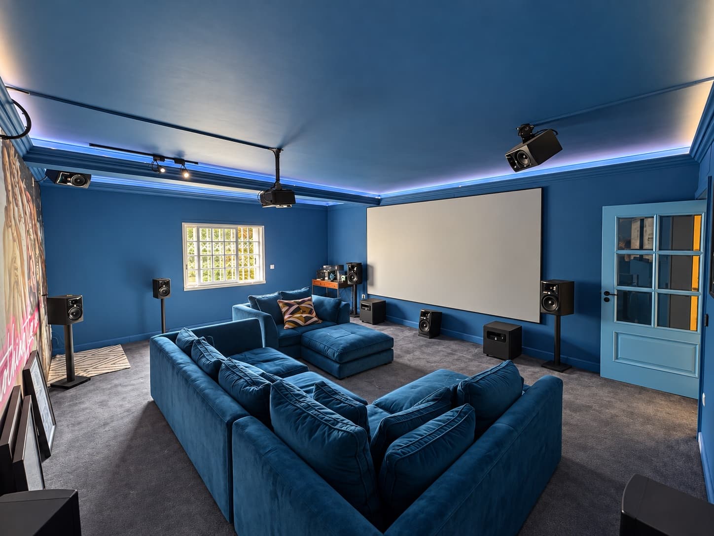 The Cinema — screen and blue velvet seating