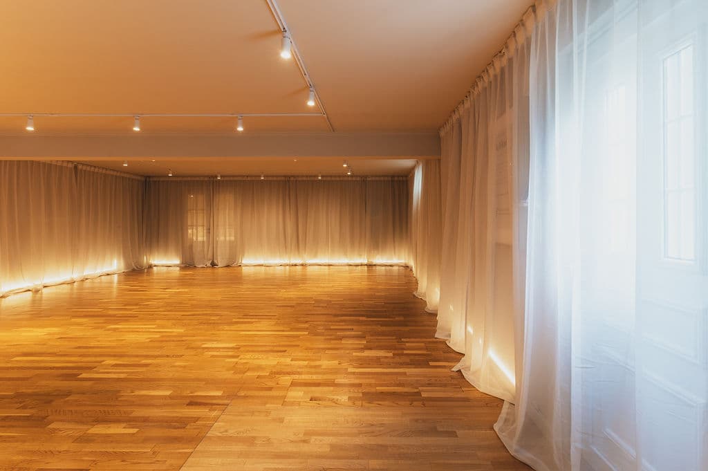 The Studio — sheer curtains and warm light