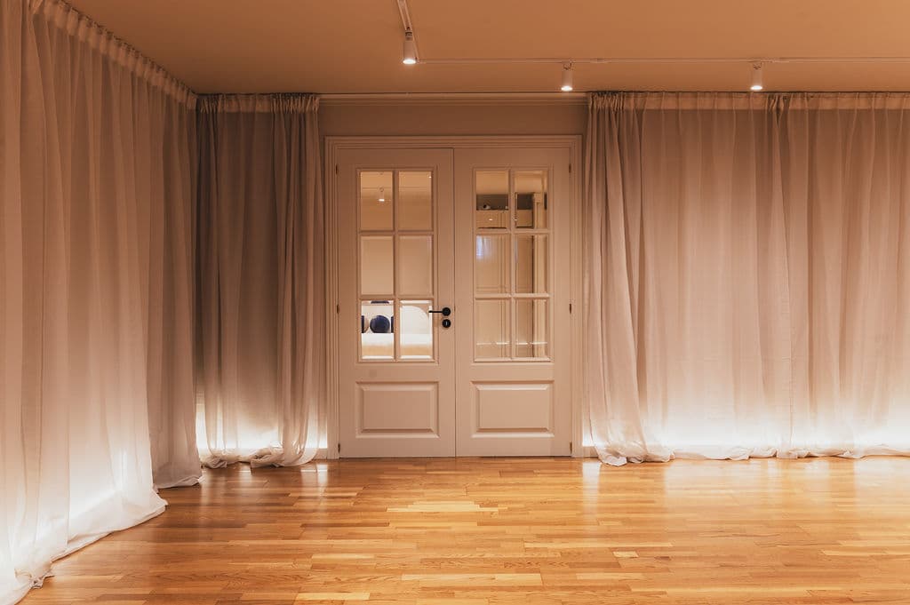 The Studio — entrance doors with curtains