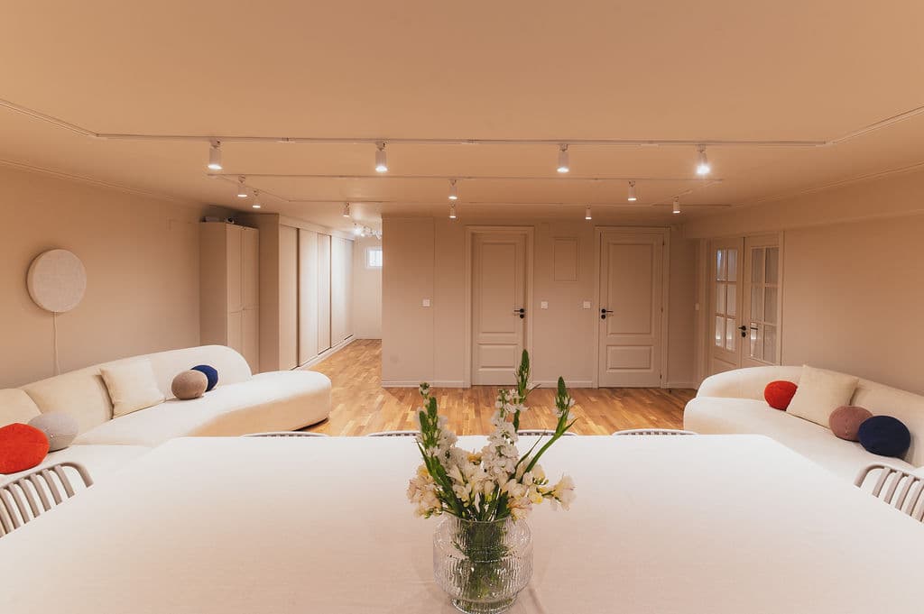 The Workshop — full room view with sofas and doors